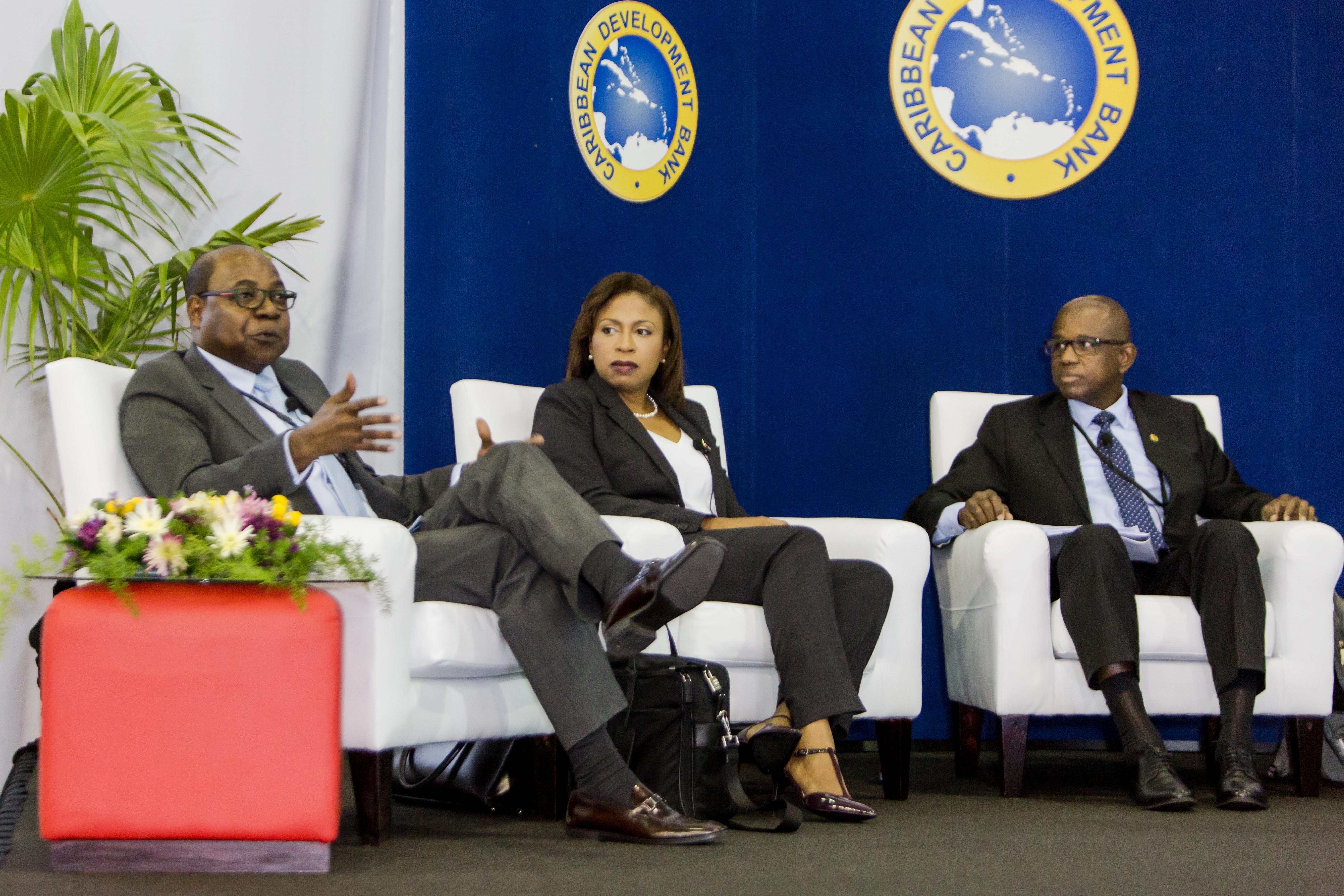 (L-R) Honourable Edmund Bartlett, Minister of Tourism, Government of Jamaica makes a point during the seminar, while Stacy Cox, Executive Director, Turks and Caicos Hotel and Tourism Association and Hugh Riley, Secretary General and Chief Executive Officer, Caribbean Tourism Organisation look on.