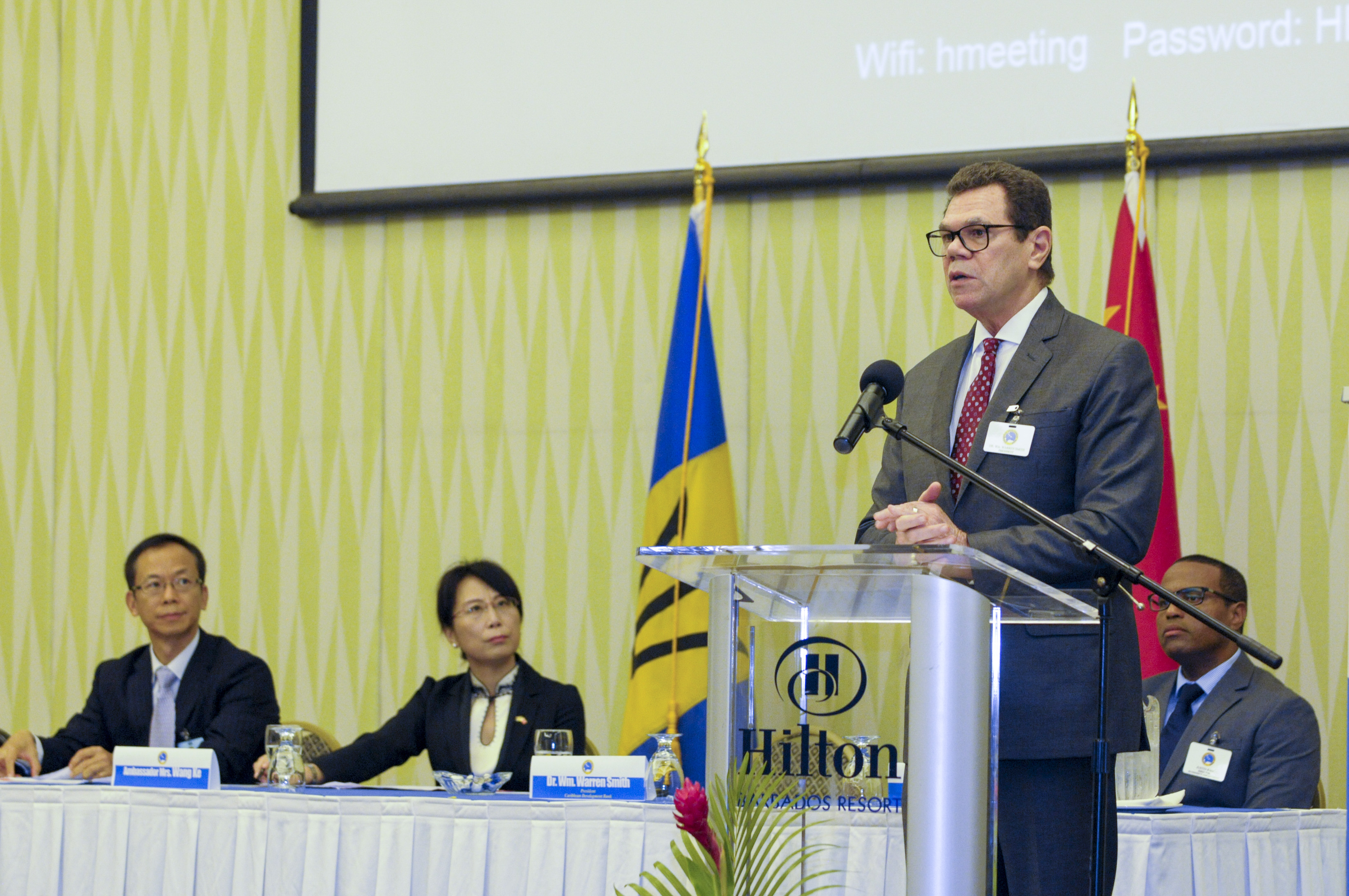 Dr. Warren Smith, President, CDB, speaking at the opening ceremony on July 10, 2017. Looking on are (L-R) Dr. Wen Xinxiang, Secretary General, Monetary Policy Committee, Director General, Monetary Policy Department, People’s Bank of China; Ambassador of the People’s Republic of China to Barbados, H.E. Wang Ke and Dr. Justin Ram, Director, Economics, CDB.