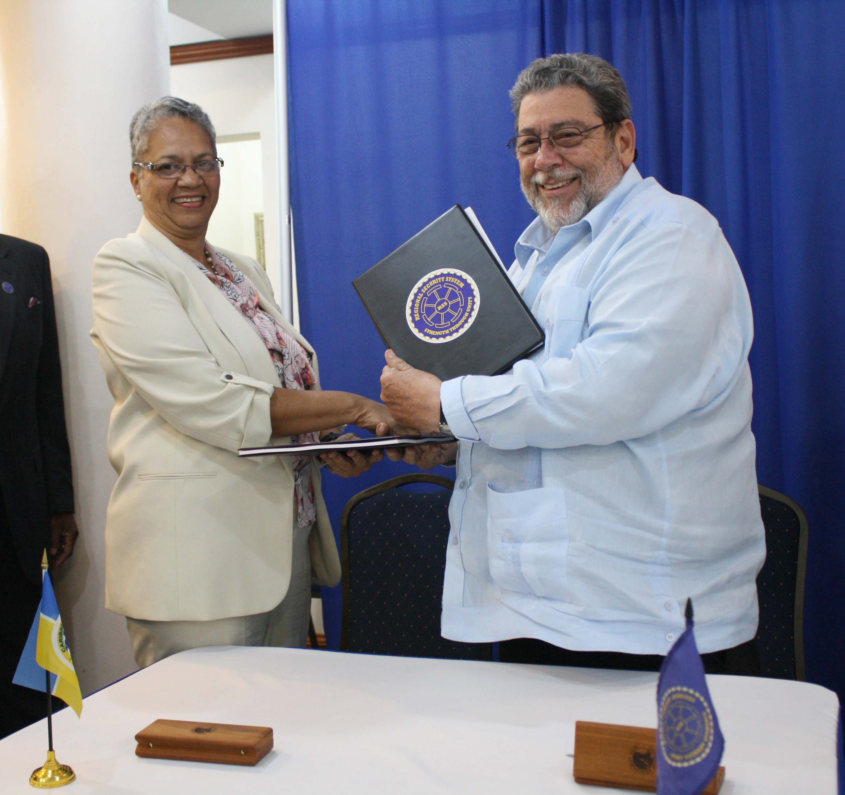 CDB Vice-President Monica La Bennett and RSS Chairman, St. Vincent and the Grenadines Prime Minister Dr. Ralph Gonsalves smiling facing camera.
