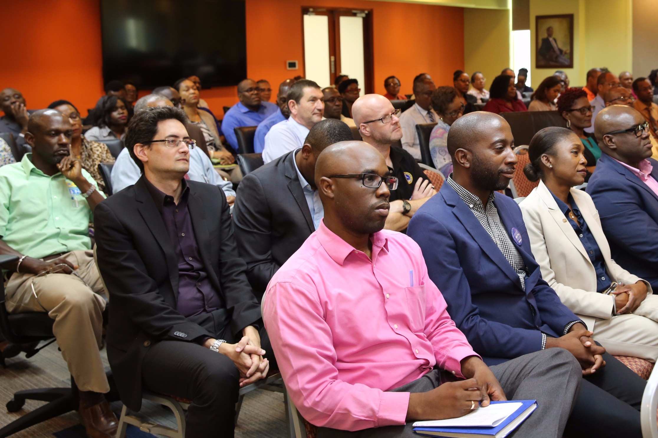 Staff listen to the address by Dr. The Right Honourable Keith Mitchell, Prime Minister of Grenada and Chairman of the Board of Governors of CDB.