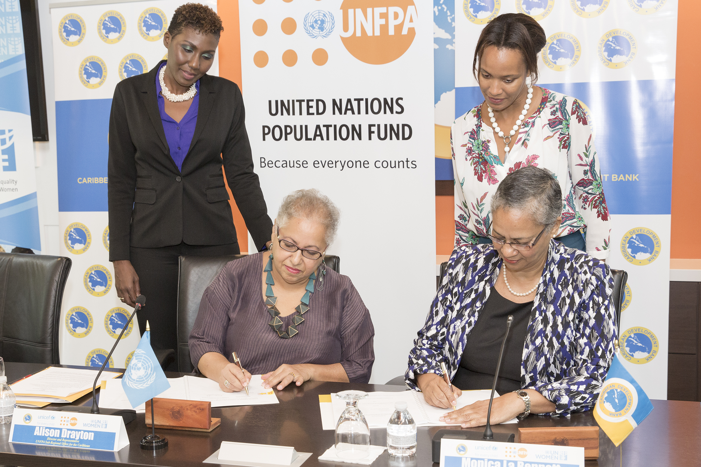 Alison Drayton, Director and Representative, UNFPA Sub-Regional Office for the Caribbean (left) and Monica La Bennett, Acting Vice-President (Operations), CDB (right).