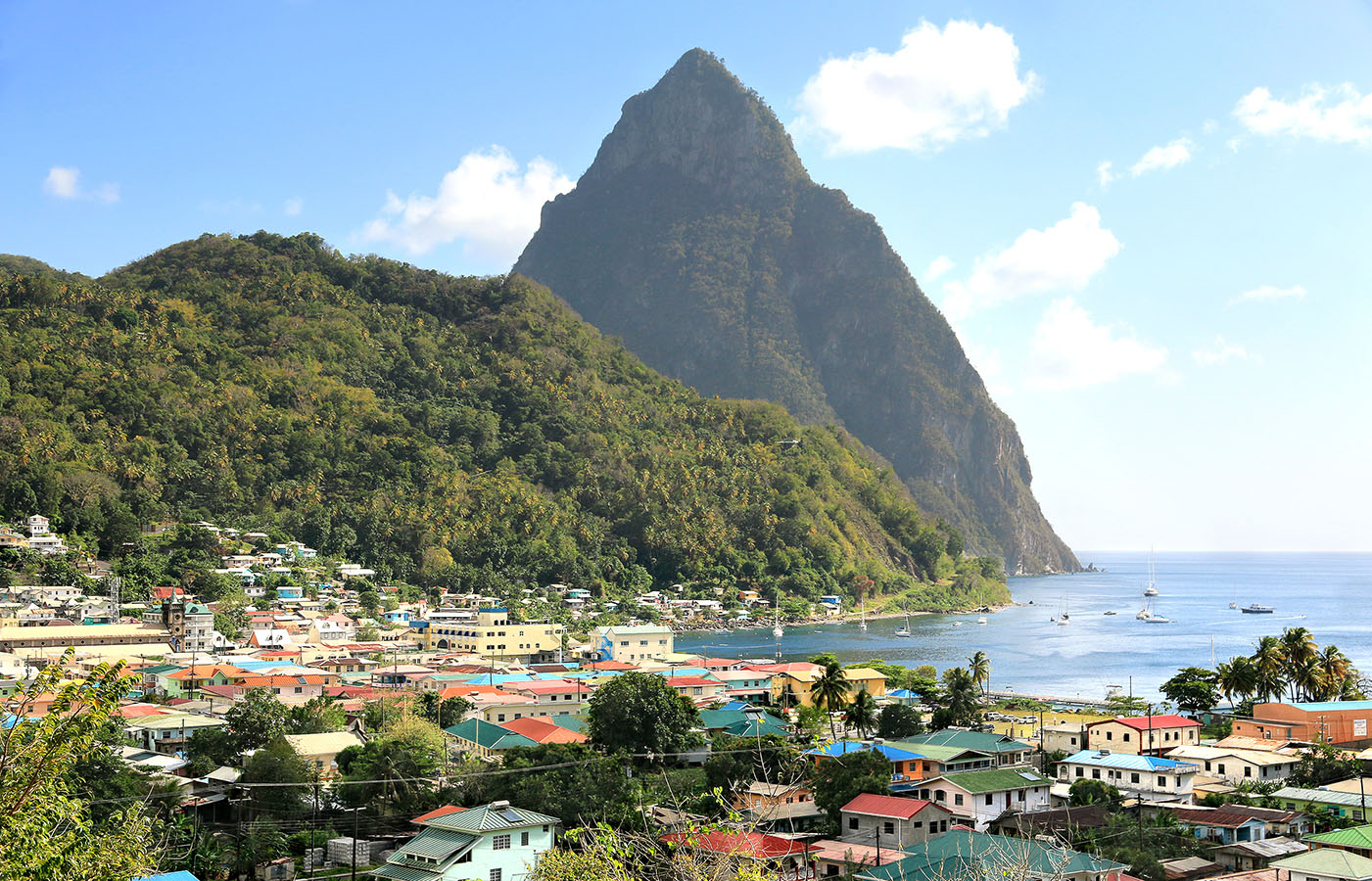 Aerial view of the small town Soufriere in Saint Lucia with The Pitons in the distance