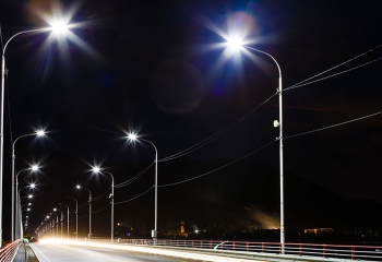 road way lit by energy efficient light-emitting diode (LED) street lights