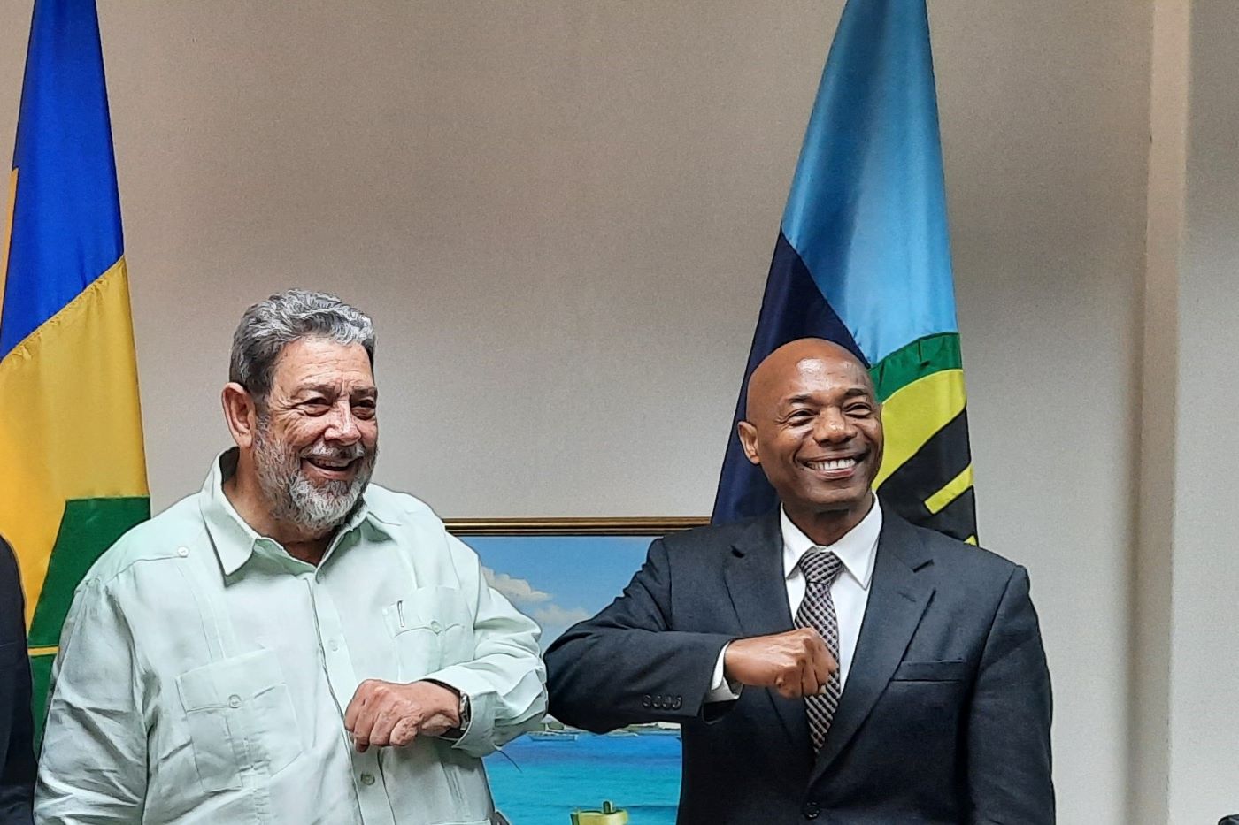 Photo #2 President of the Caribbean Development Bank (CDB) Dr. Gene Leon (left) is warmly greeted by Prime Minister of St. Vincent and the Grenadines, (SVG) Dr. Ralph Gonsalves