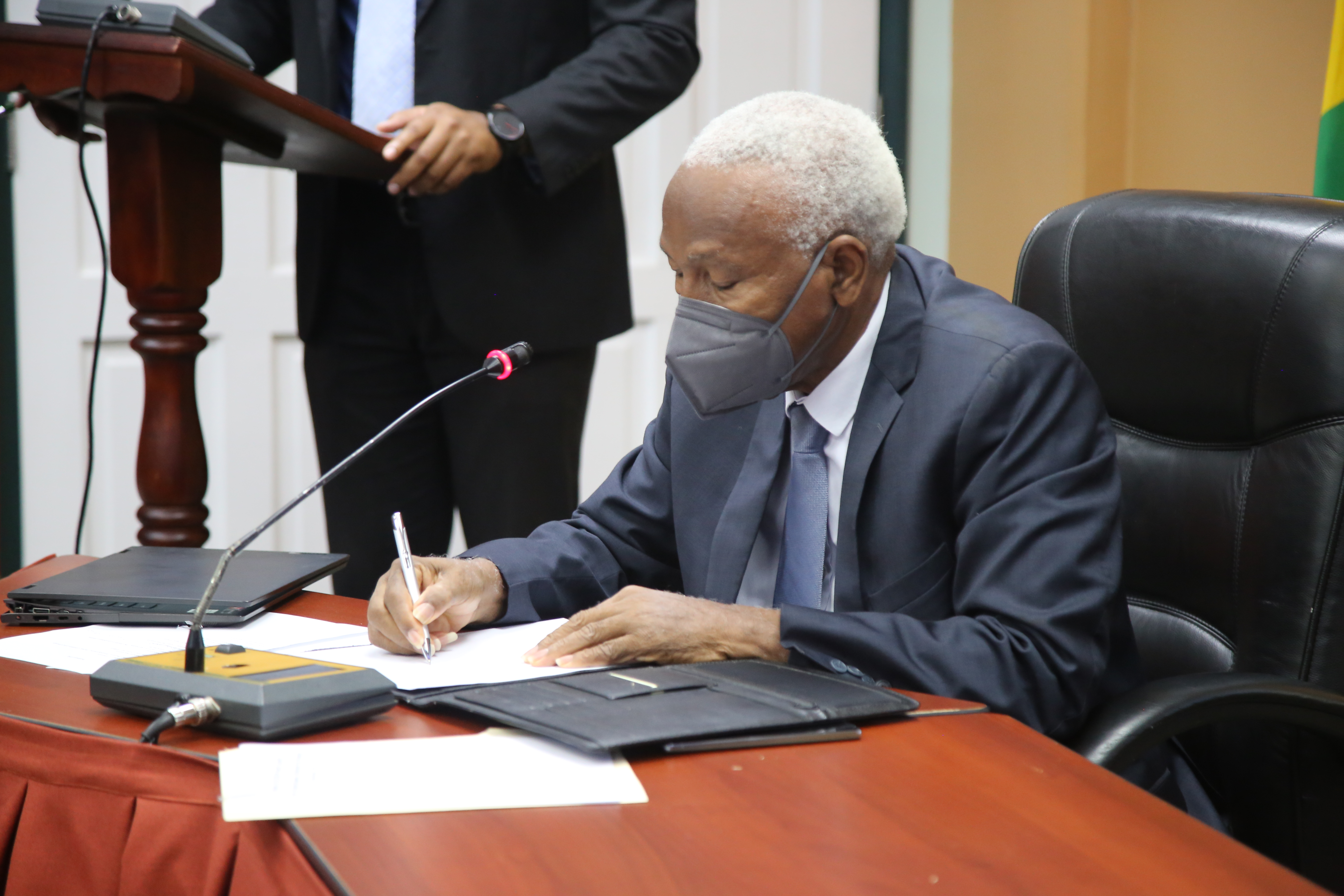 Grenada's Minister of Finance Signing Grant Agreement 