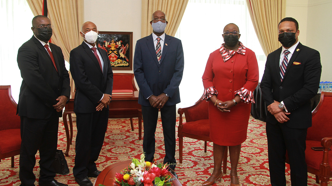 CBD President Dr Gene Leon in dark suit (second left), meeting Prime Minister of Trinidad and Tobago, Dr Keith Rowley in dark blue suit (centre). Also in attendance were CDB Vice-President of Operations, Isaac Solomon in dark suit (far left); Minister of Planning and Development and CDB Governor for Trinidad and Tobago,. Camille Robinson-Regis in red costume (second right); and Minister of Foreign and CARICOM Affairs, Dr Amery Browne in dark suit (far right)