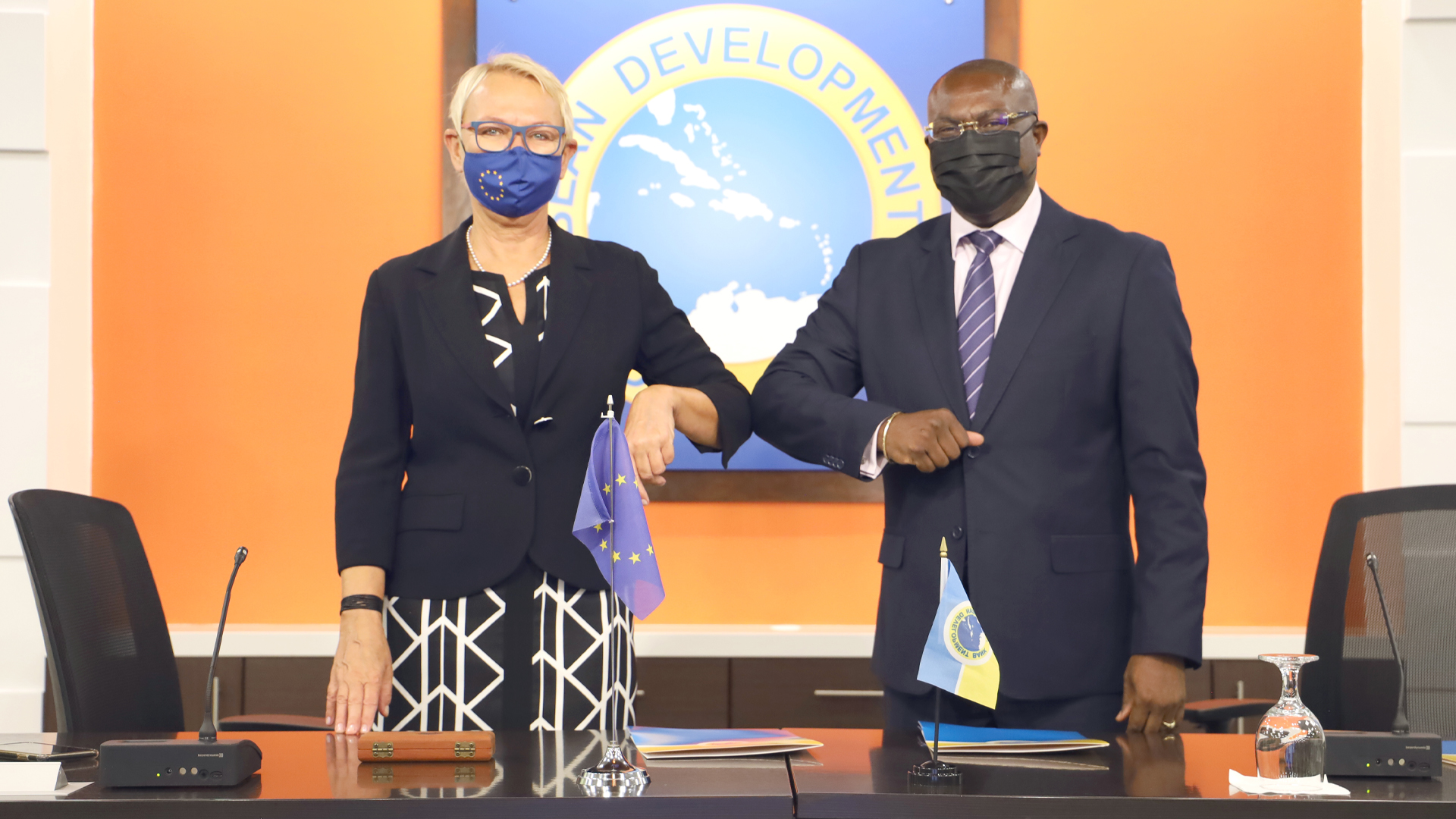 EU Ambassador Malgorzata Wasilewska and CDB Vice-President Isaac Solomon bump elbows