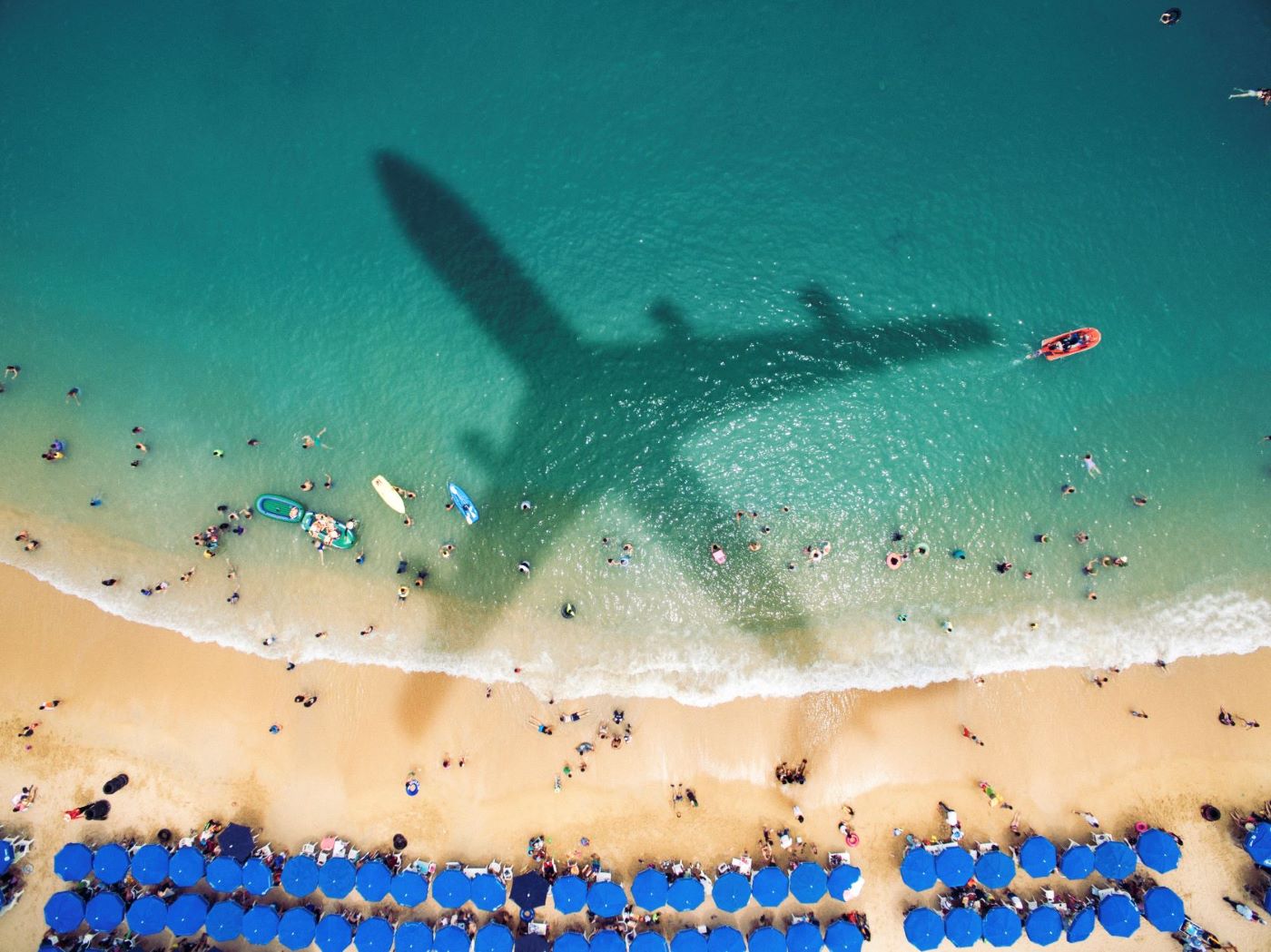shadow of plane over beach