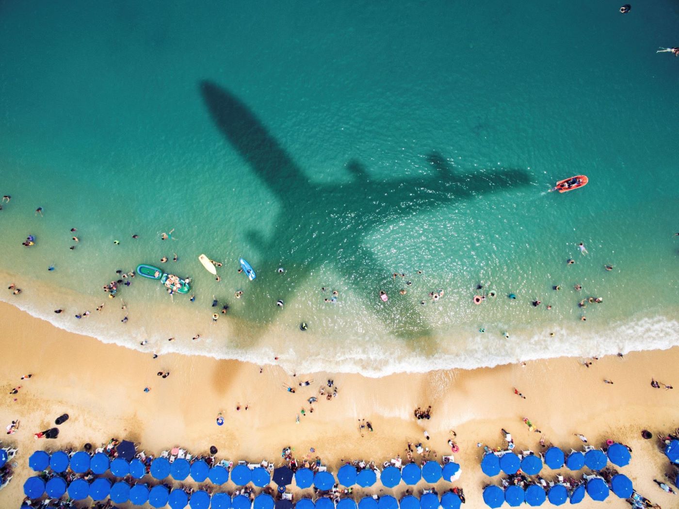 shadow of plane over beach