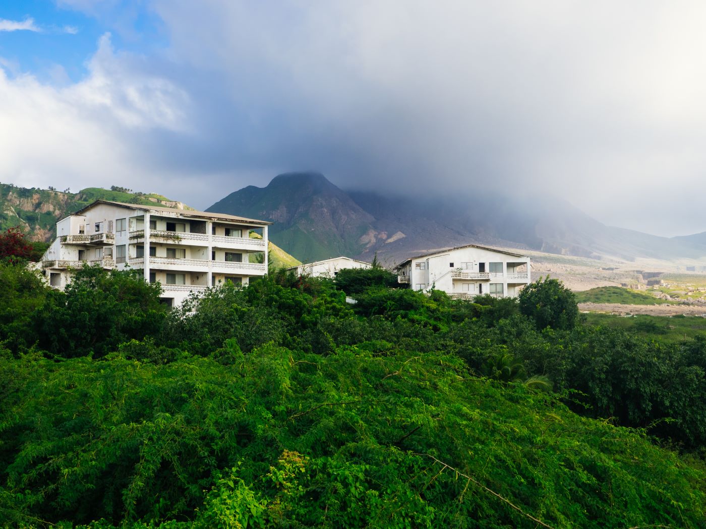 view of la Soufriere over lush hills in Montserrat