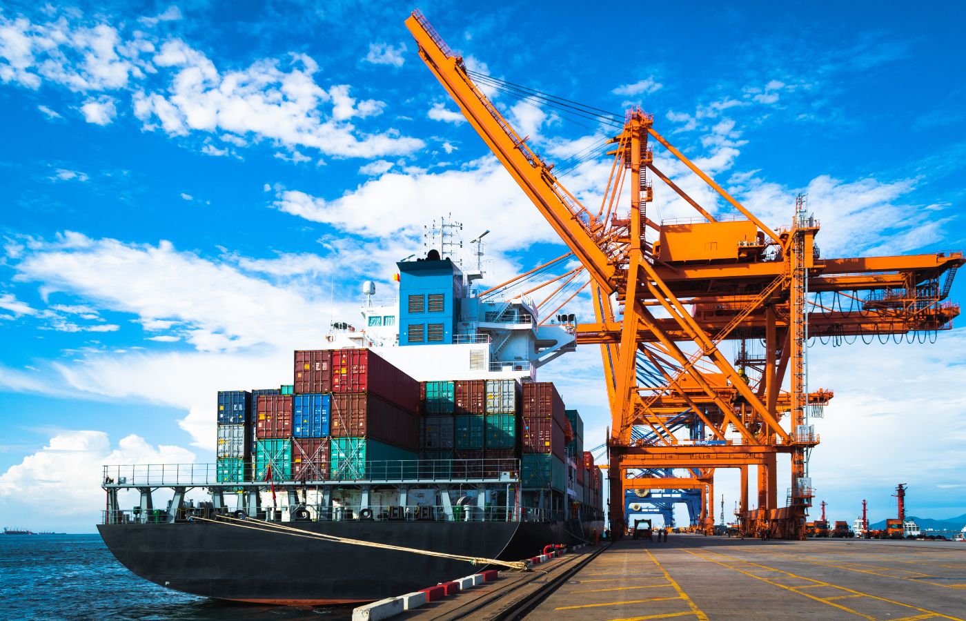 cargo ship being offloaded at a port