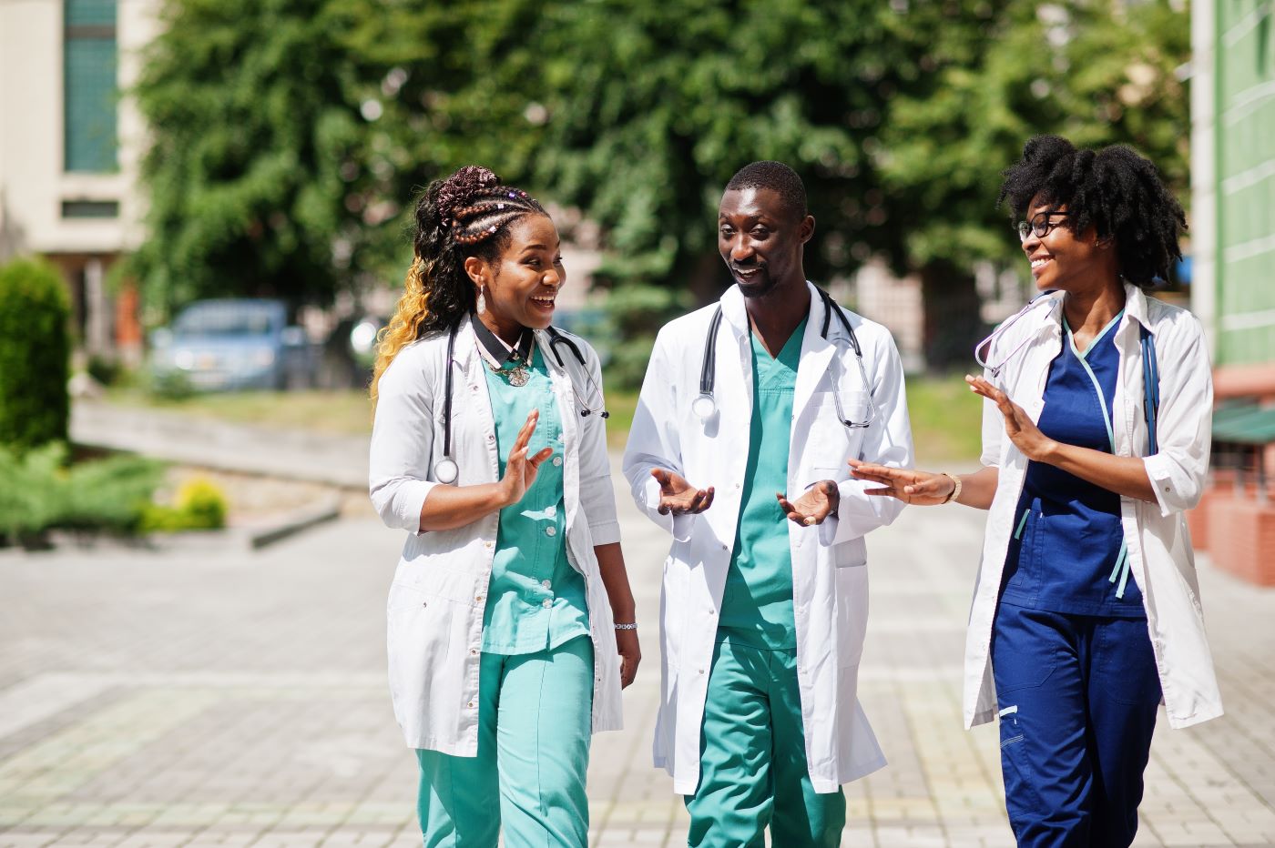 Health care workers walking and talking outside