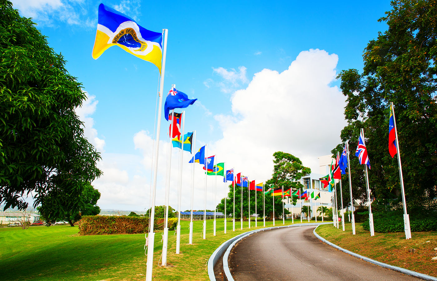 CDB driveway with member country flags blowing in the wind