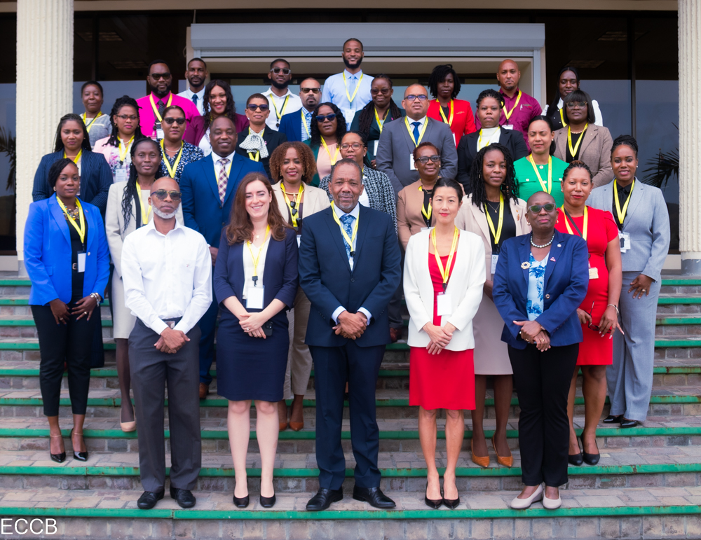 Group of black people in colourful business attire standing in tiered rows