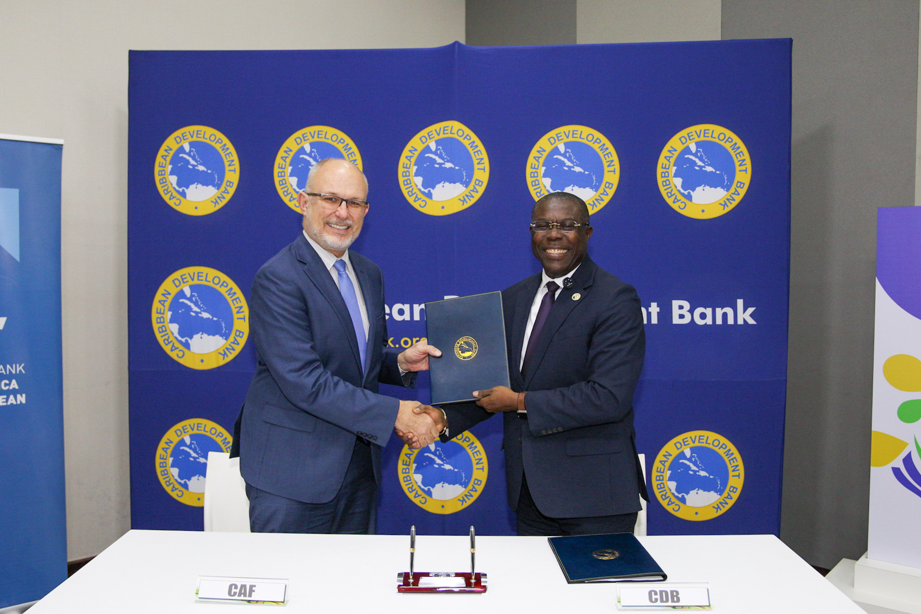 Caribbean Development Bank Vice President, (Operations) Dr. Isaac Solomon (left) and CAF Vice President for Private Sector, Mr. Antonio Silveira, shake hands to seal the deal after signing a Memorandum of Understanding aimed at boosting cooperation in key sectors that are essential to accelerating sustainable development for the Caribbean region. The agreement was signed on June 10, 2025 at the CDB’s 55th Annual Meeting currently underway in Brasilia, Brazil.