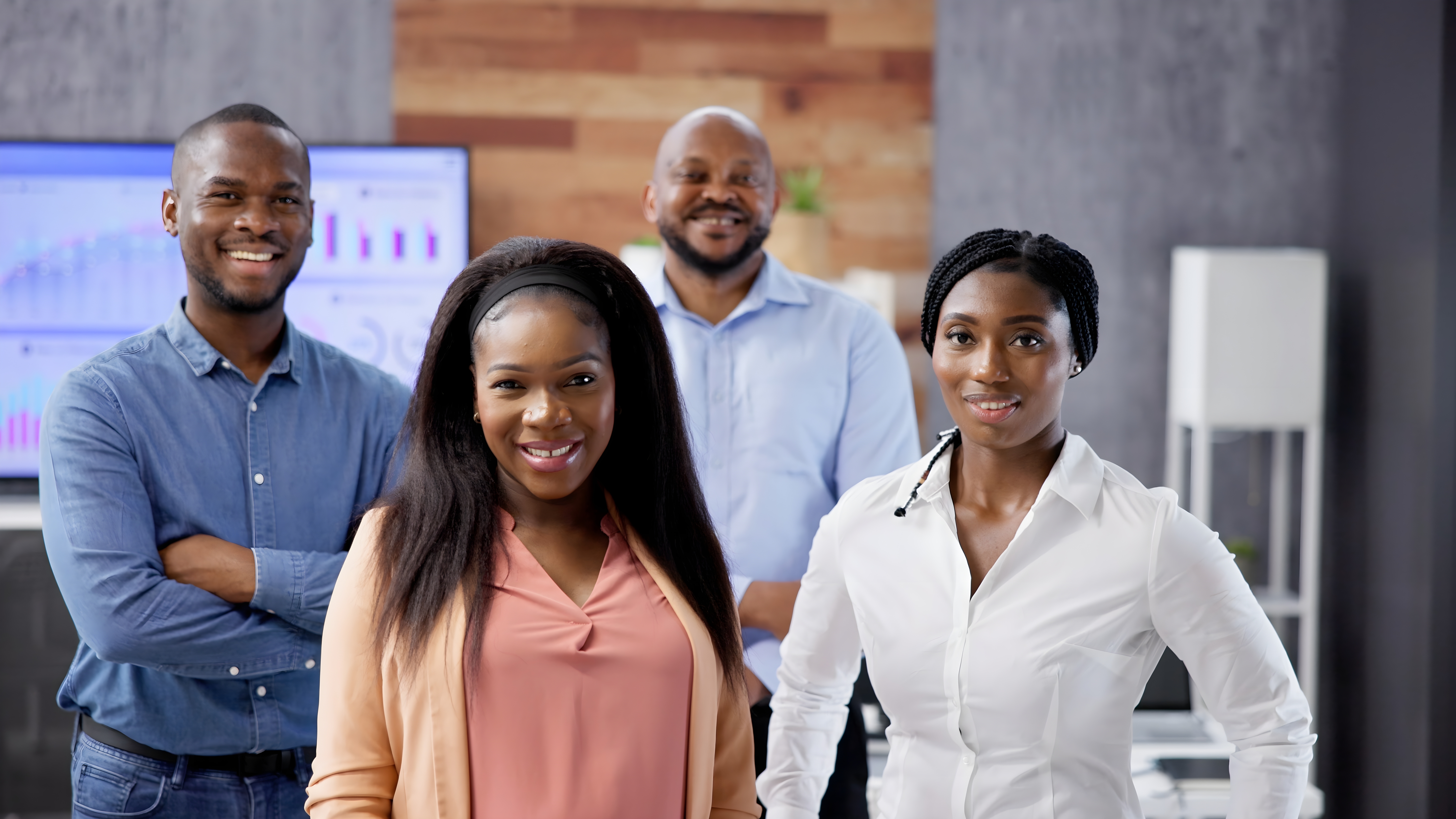 Happy group of business people standing in an office