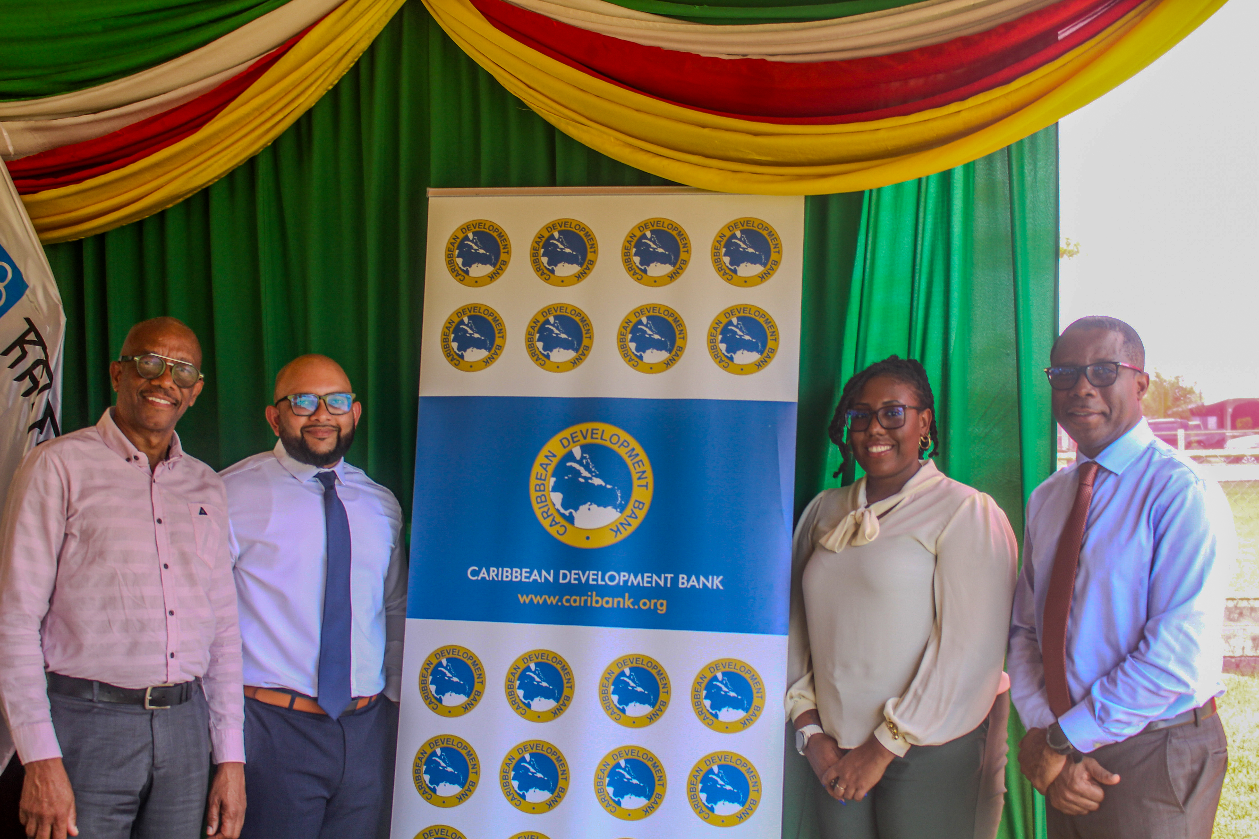 Four members of the Caribbean Development Bank team attend the commissioning of two new energy substations in Suriname.