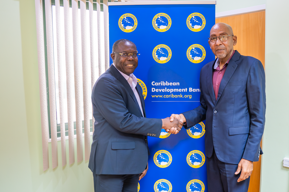 CDB Vice-President (Operations), Dr. Isaac Solomon, joins Dominica’s Minister of Finance, Dr. the Honourable Irving McIntyre, for a photo during the recent Country Portfolio Review and Country Engagement Strategy meetings.. 