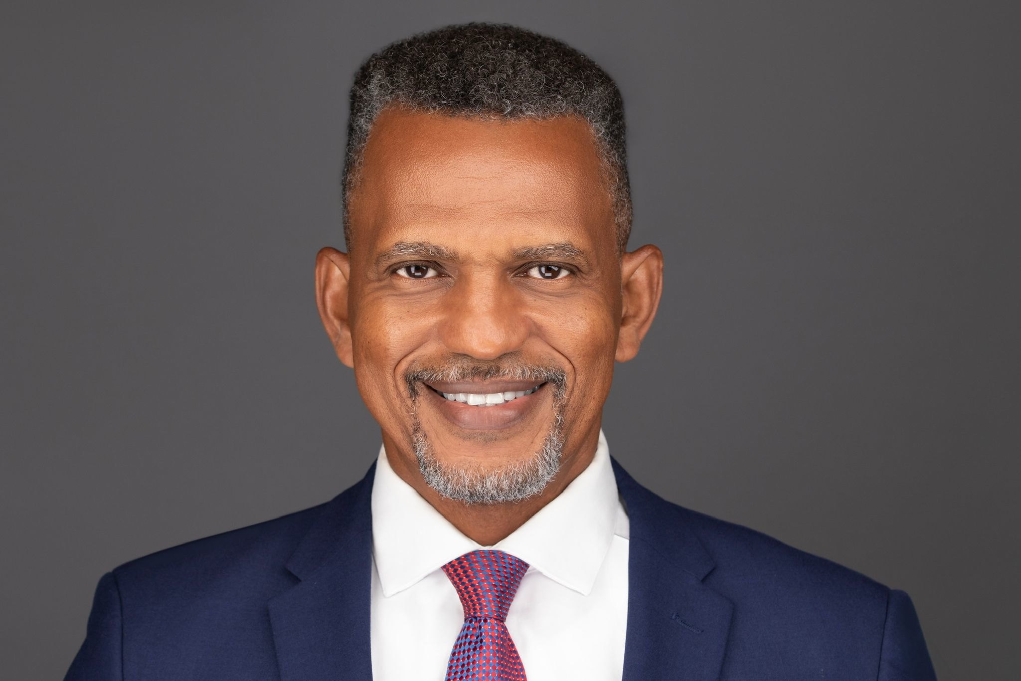 Portrait of a man smiling.