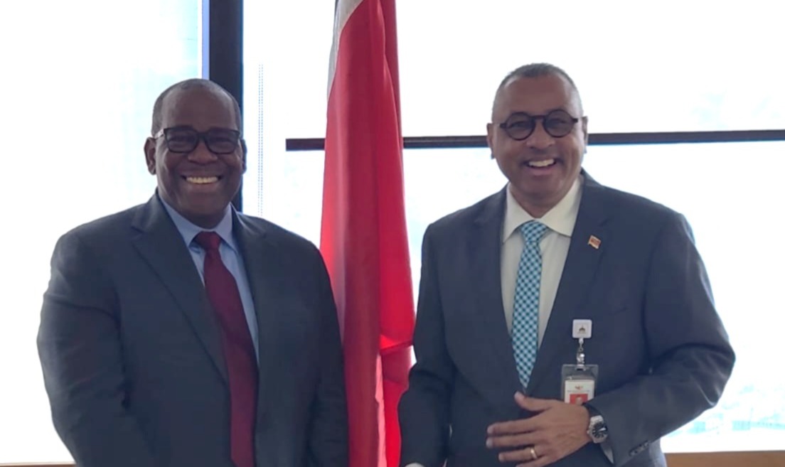 Mr. Alexander Augustine, CDB Portfolio Manager, and Dr. The Honourable Kennedy Swaratsingh, Minister of Planning, Economic Affairs and Development, Trinidad and Tobago, pose for a photo during a meeting.