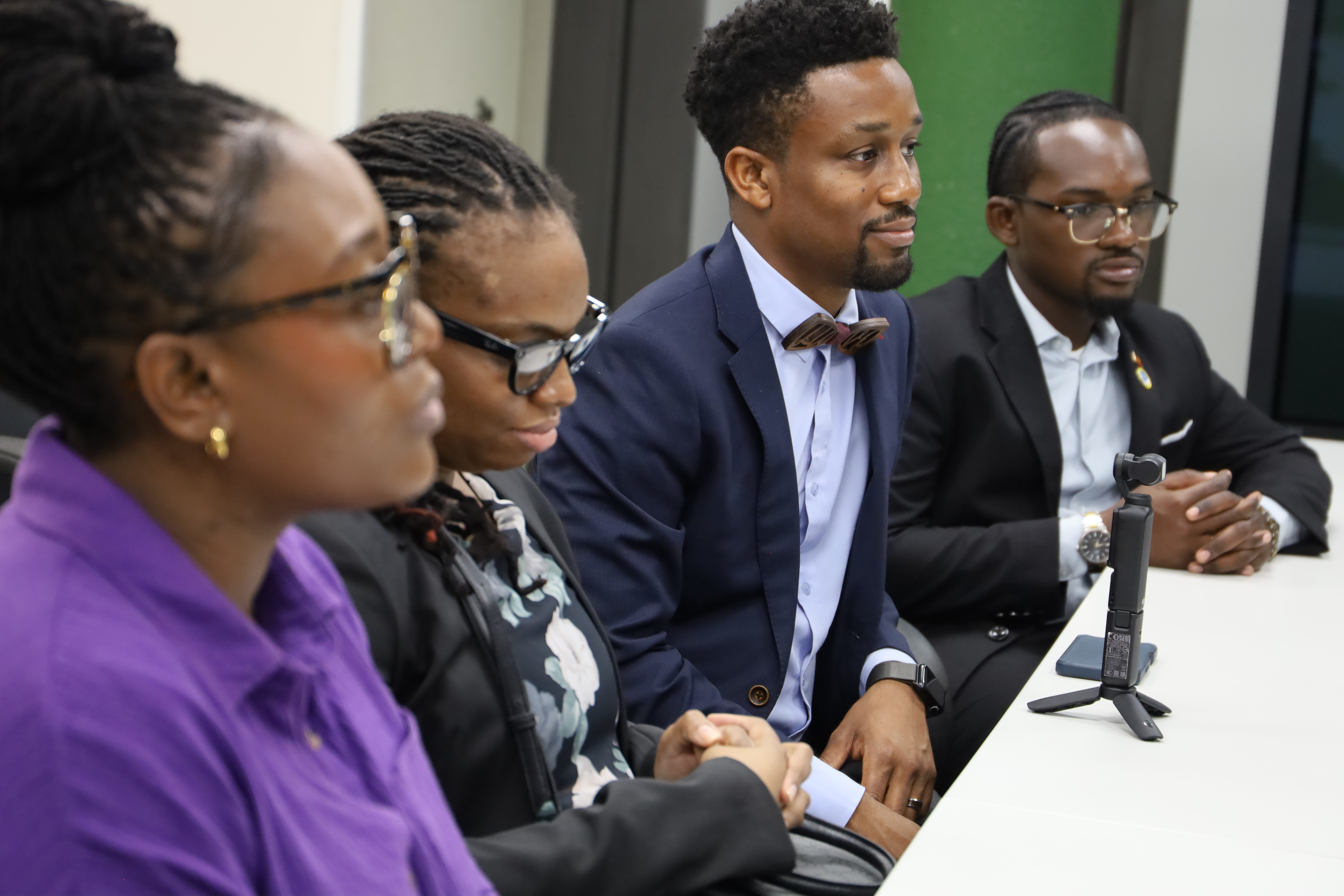 Caribbean Development Bank Future Leaders Network members Chemora Mcknee, Janeil Odle, Shemeon Williams, and Esquire Henry participate in a meeting to discuss issues affecting Caribbean youth.