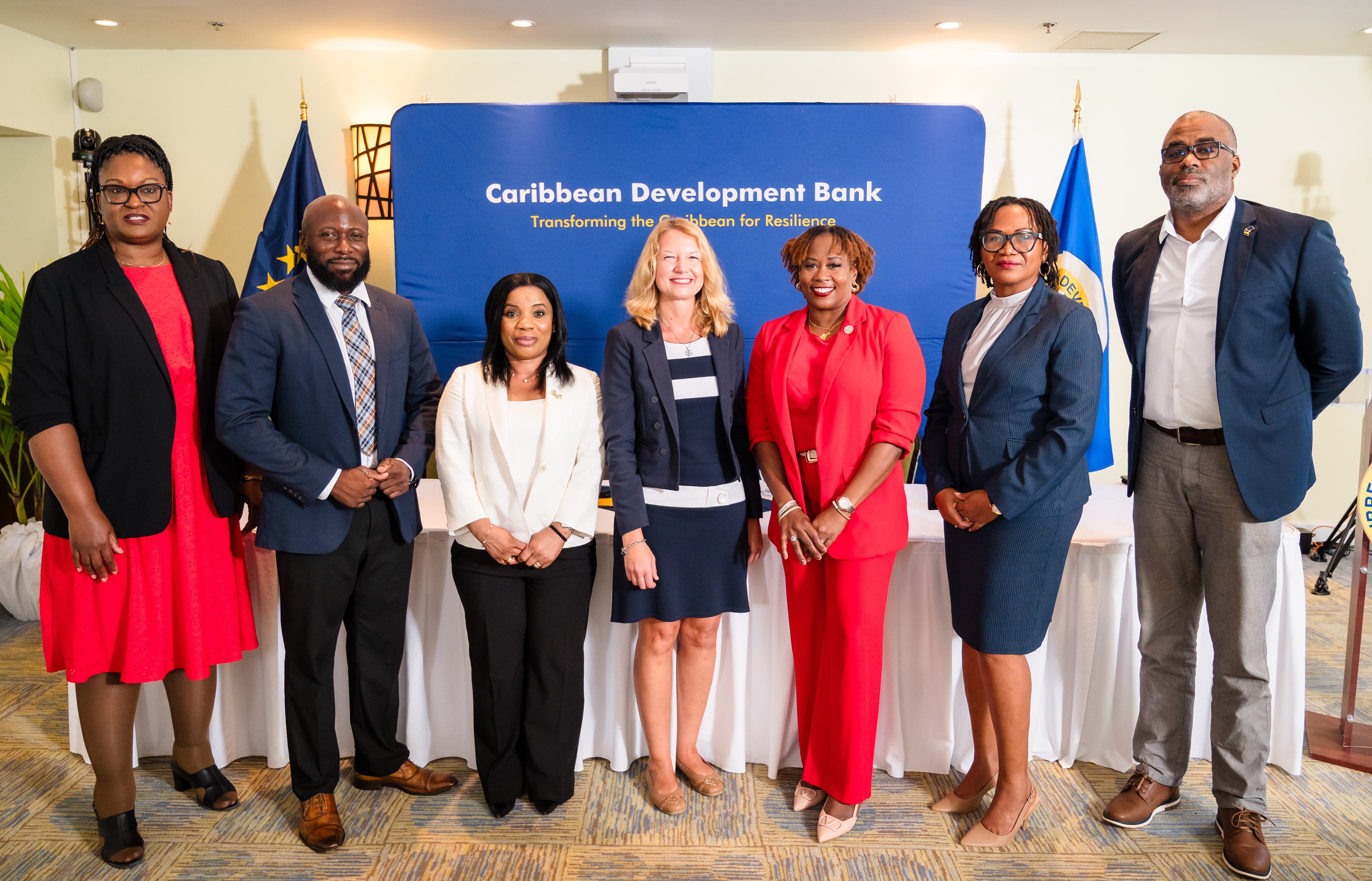 Group of partners from EU, CDB, CARIFORUM and Government of Barbados standing and smiling
