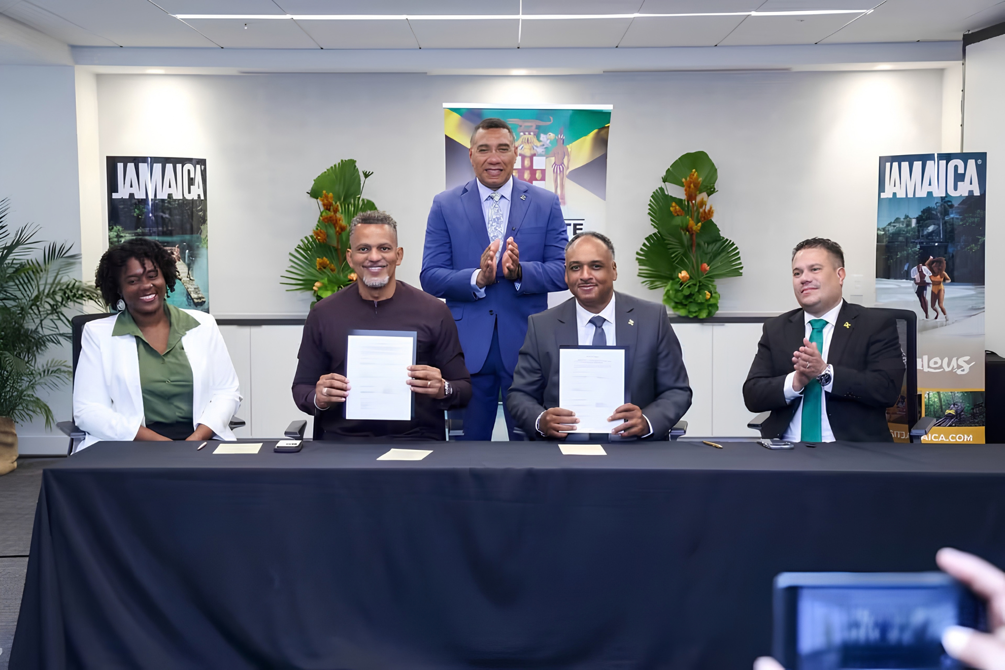 Representatives from the Government of Jamaica, the Caribbean Development Bank, and the Rural Water Supply Limited applaud the new agreement.