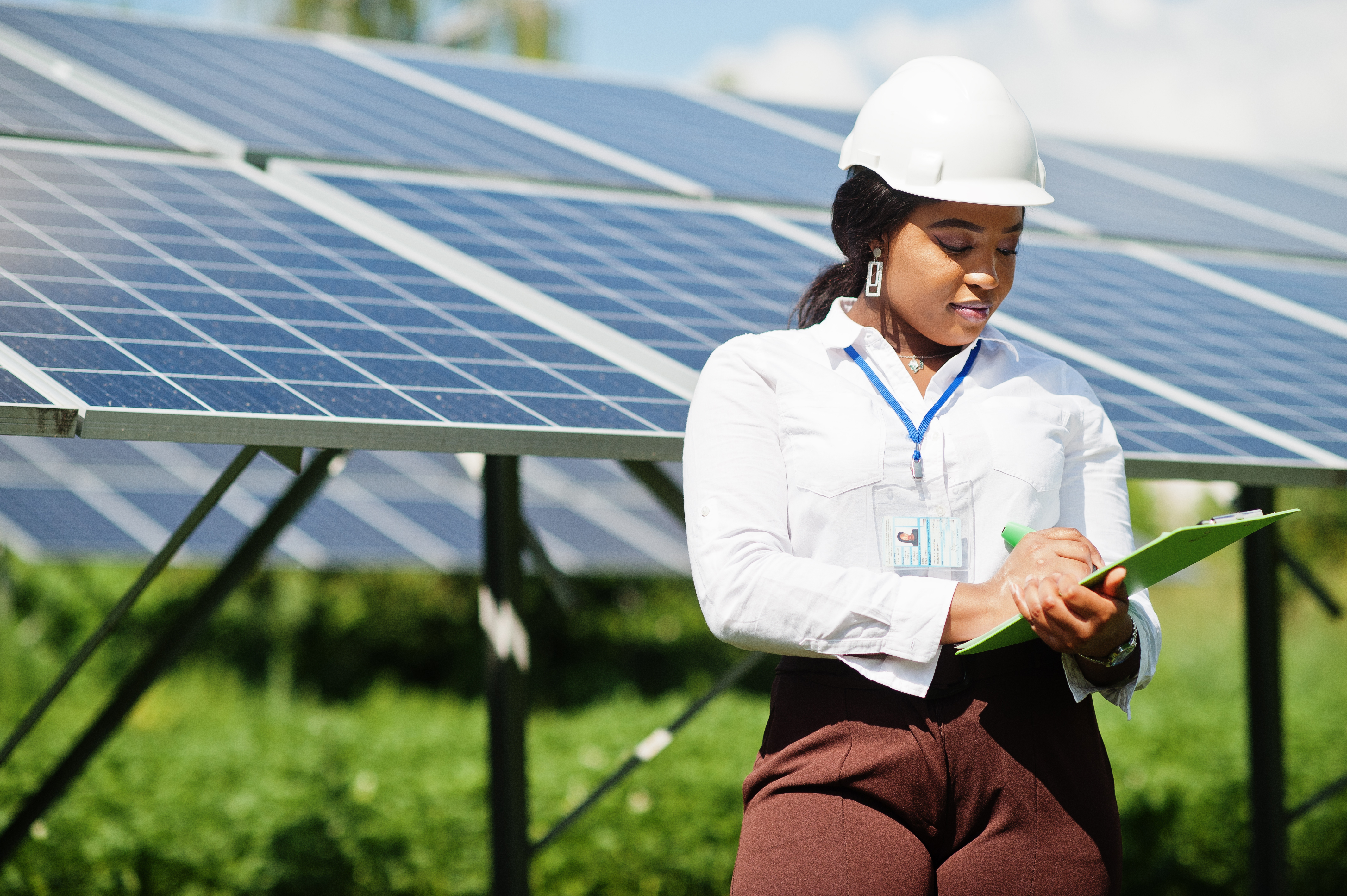 female technician at solar power field