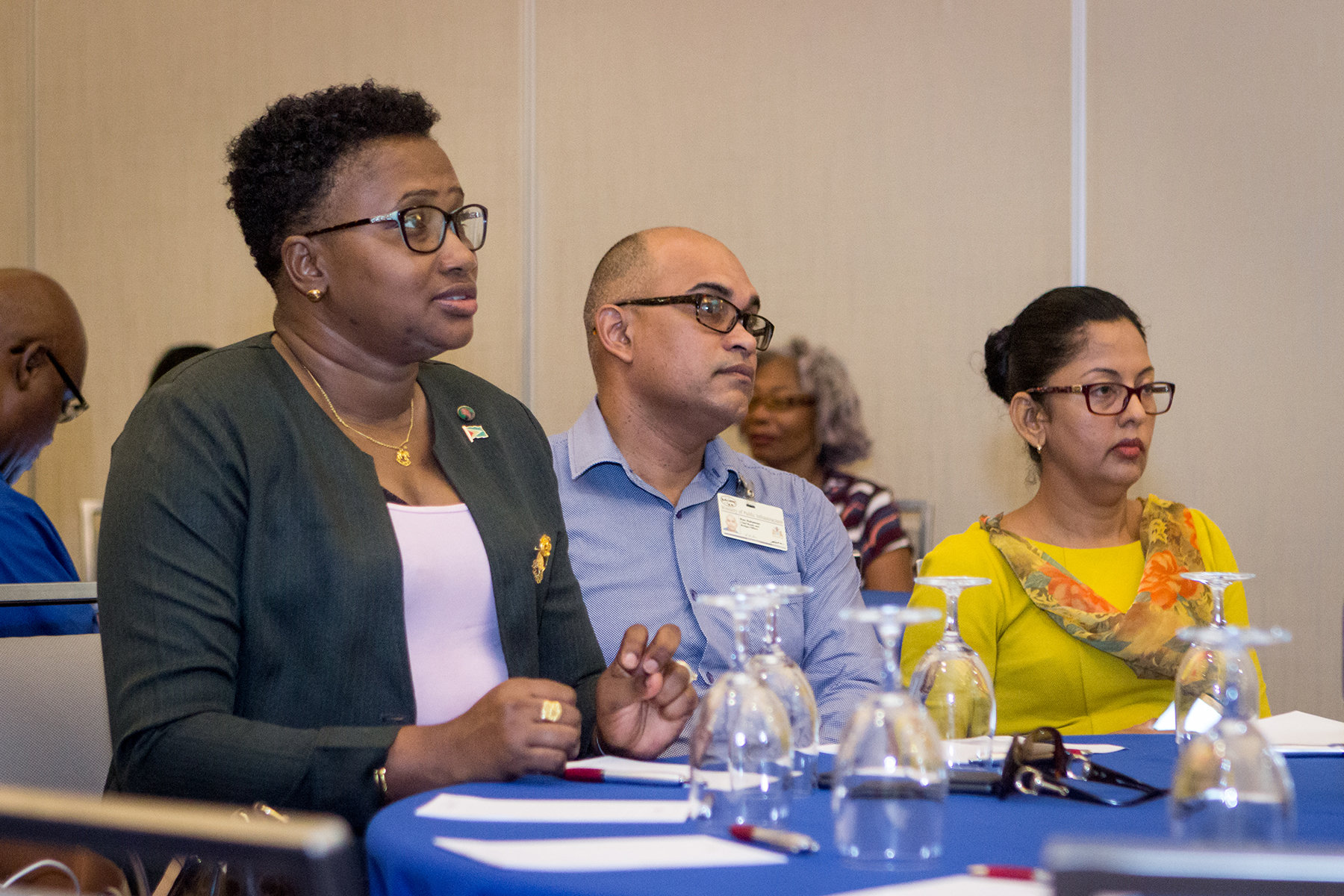 Minister in the Ministry of Public Infrastructure, Annette Ferguson (left) and others at the session.