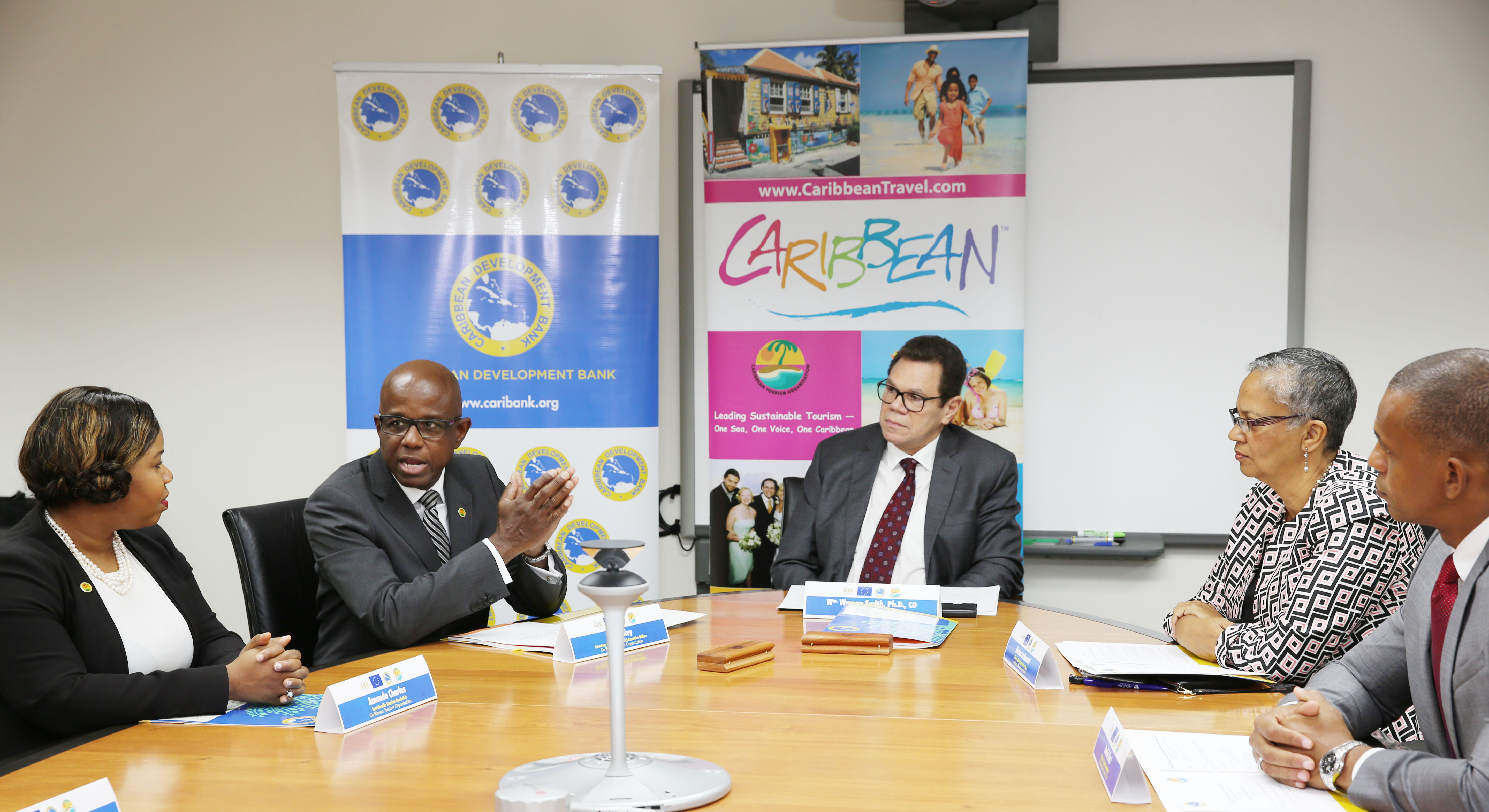 From left to right: Amanda Charles, Sustainable Tourism Development Specialist, CTO; Hugh Riley, Secretary General, CTO; Dr. Wm. Warren Smith, President, CDB; Monica La Bennett, Acting Vice-President (Operations), CDB; and Daniel Best, Director of Projects, CDB chat during the signing ceremony on June 22, 2017.