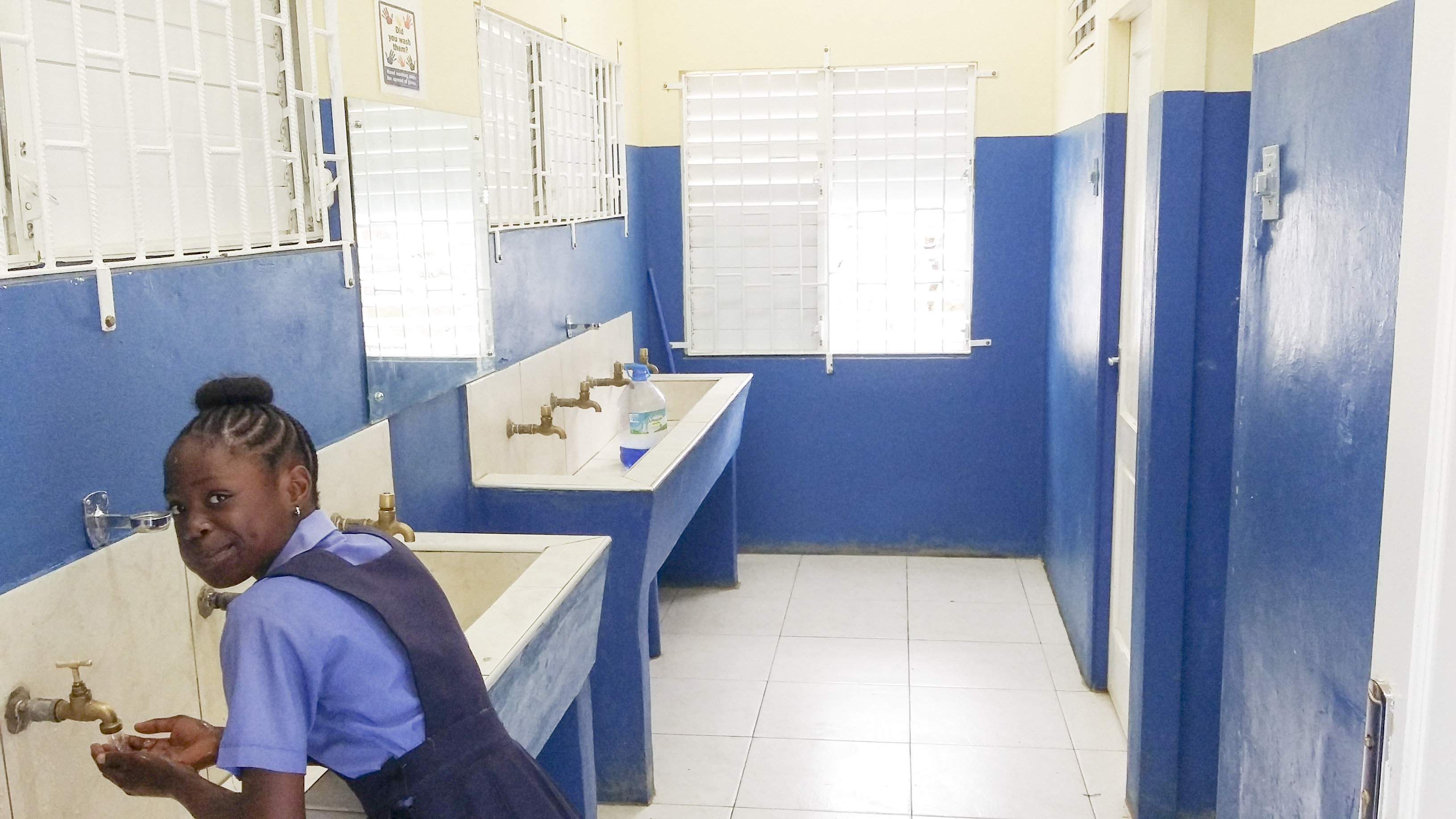 A student from the Christiana Moravian Primary & Infant School uses the newly refurbished bathrooms.