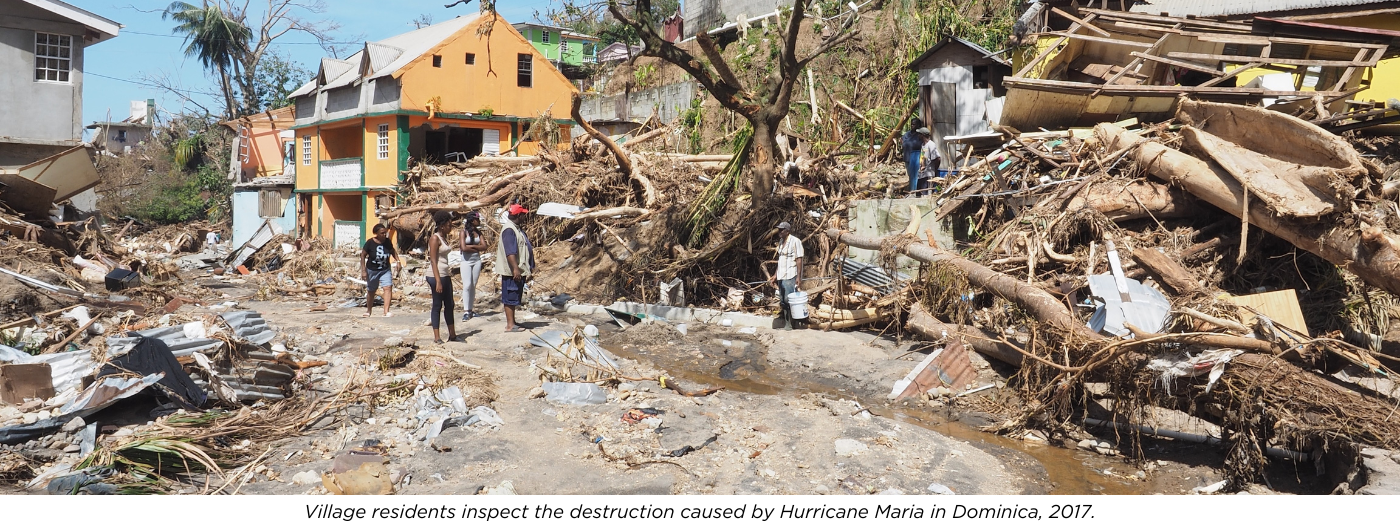 Village residents inspect the destruction caused by Hurricane Maria in Dominica, 2017.
