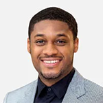 young smiling black man in grey jacket with black shirt