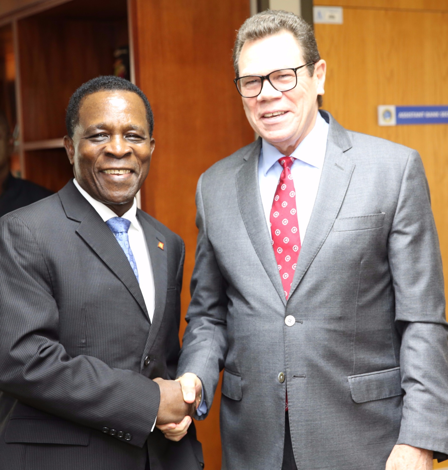 Dr. The Right Honourable Keith Mitchell, Prime Minister of Grenada and Chairman of the Board of Governors of CDB (left) greets Dr. Wm. Warren Smith, CDB President (right), during an official visit to the Bank on June 23, 2017.