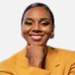 young smiling black female in yellow jacket with fist under chin