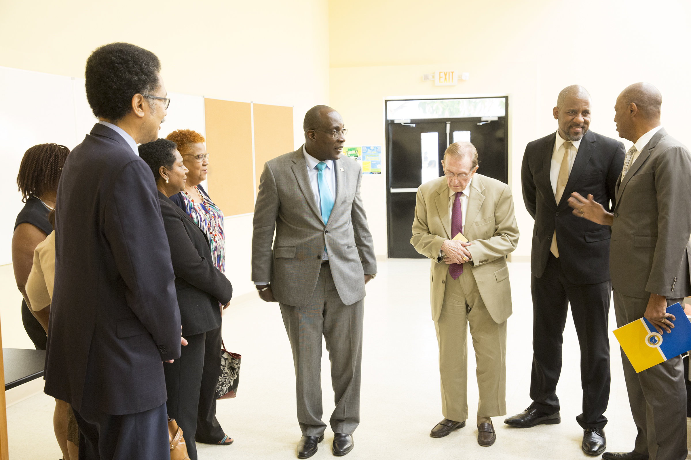 Professor Stephen Vasciannie, President, UTech, first left; Senator, the Hon. Ruel Reid, Minister of Education, Youth and Information, centre and UTech’s Chancellor, former Prime Minister of Jamaica, Mr. Edward Seaga, third from right, discuss UTech’s new and improved facilities with Stepehen Lawrence, Operations Officer (Civil Engineer), Social Sector Division, CDB, far right.