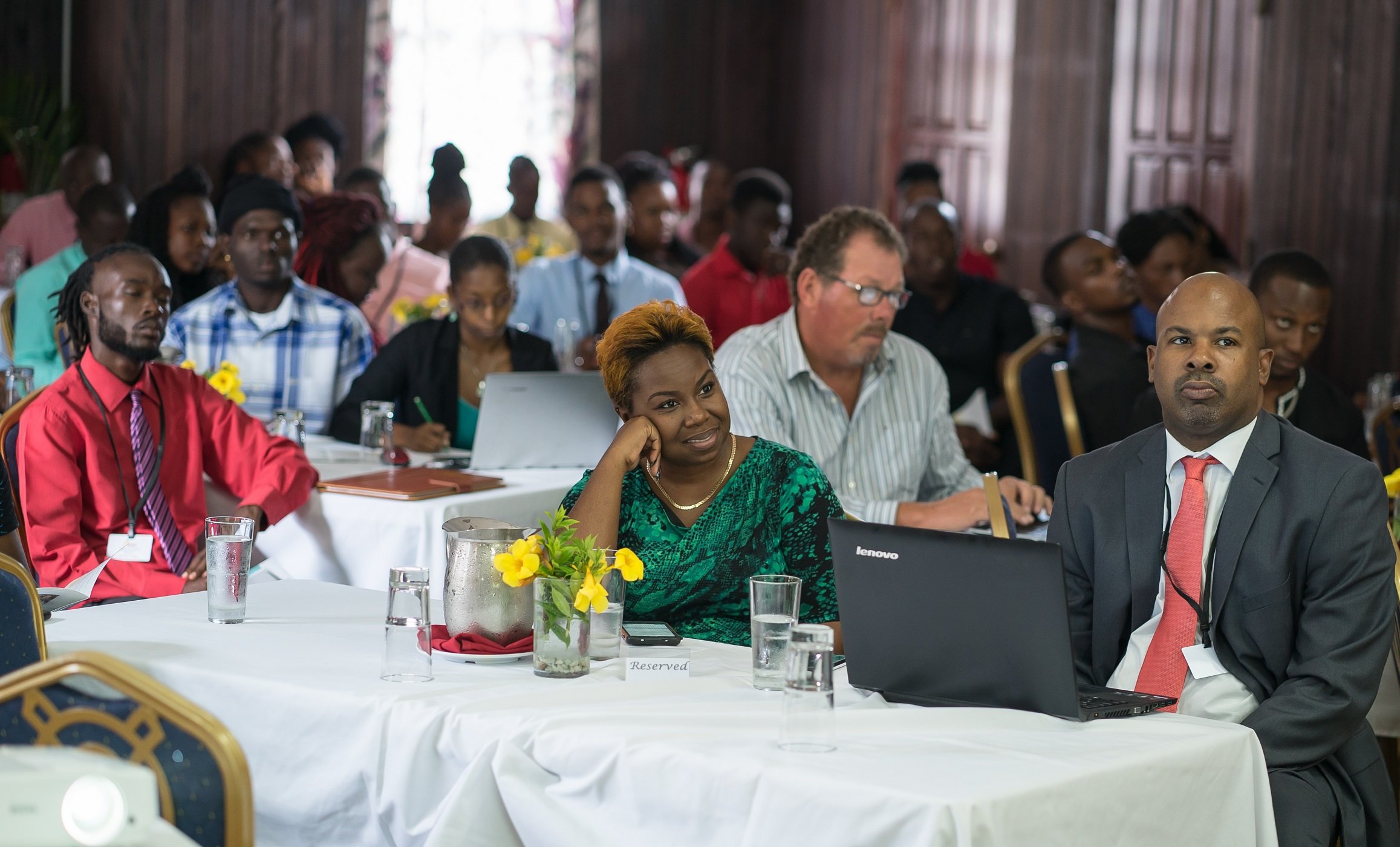 Participants and facilitators attend the Opening Ceremony of the Vybzing Grenada Bootcamp on May 23, 2018.