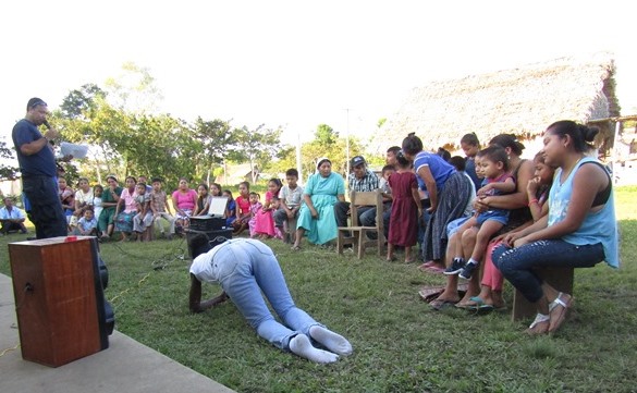 volunteer demonstrating a fire safety position 