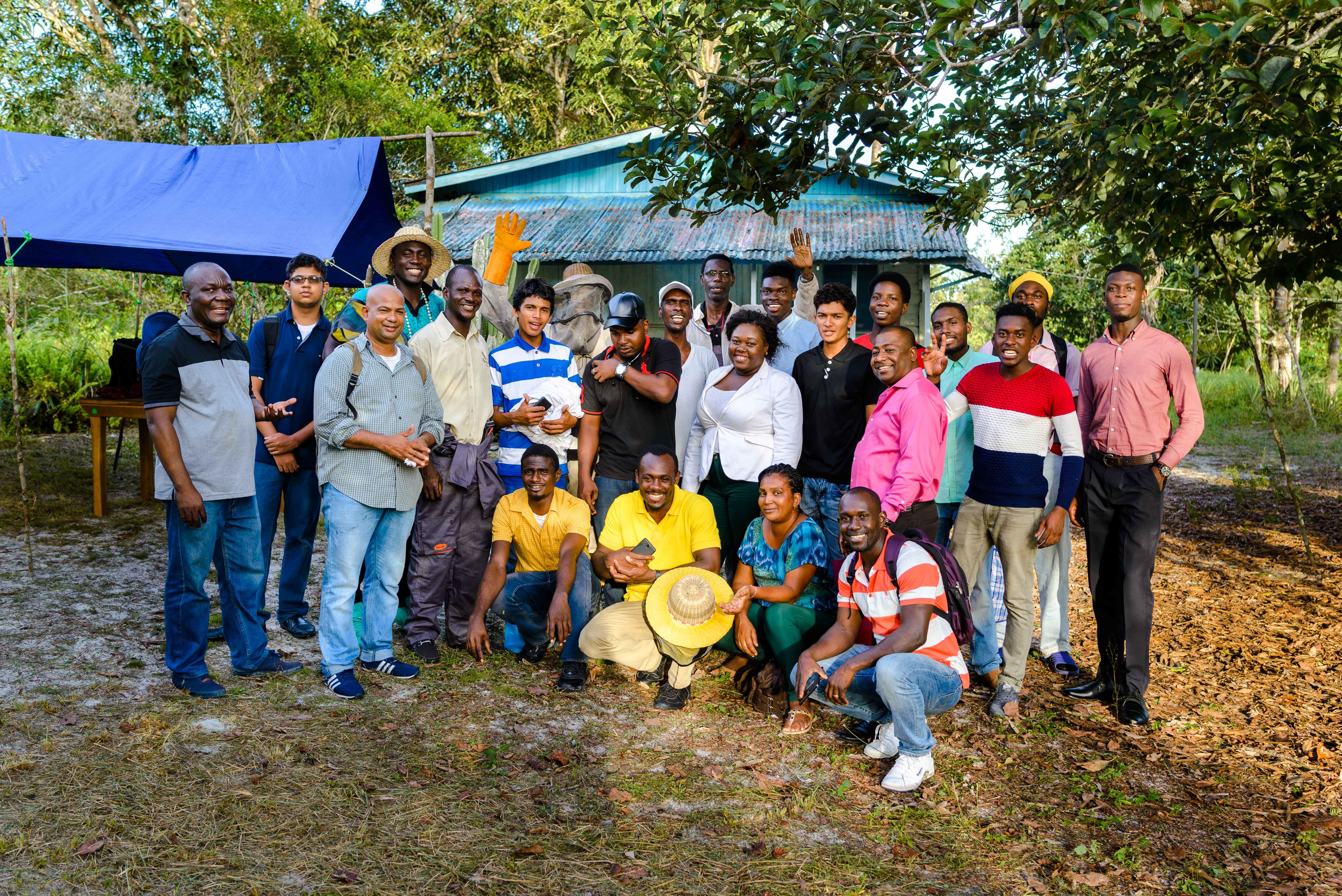 The newly trained beekeepers gather for a group photo.