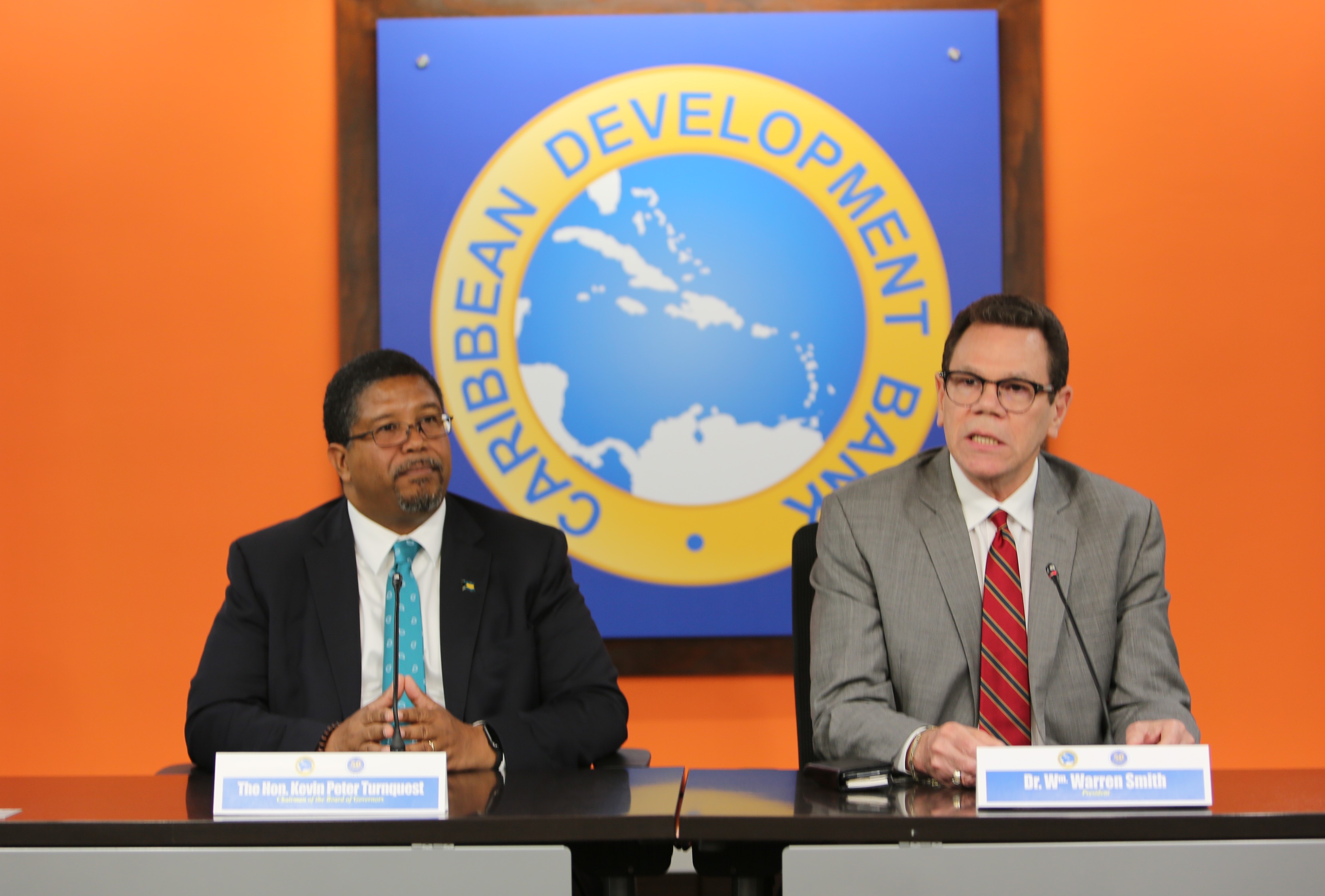 Deputy Prime Minister of The Bahamas and Chairman of CDB’s Board of Governors, the Hon. Kevin Peter Turnquest (l.) and CDB President Wm. Warren Smith