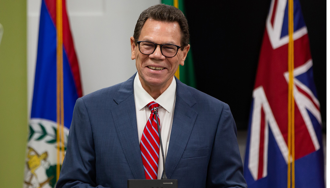 CDB President Dr Wm Warren Smith, wearing a blue suit and a red tie