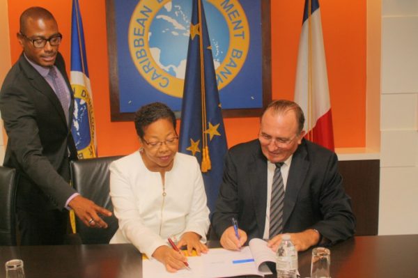 CDB VP Mckenzie signs agreement with AFD