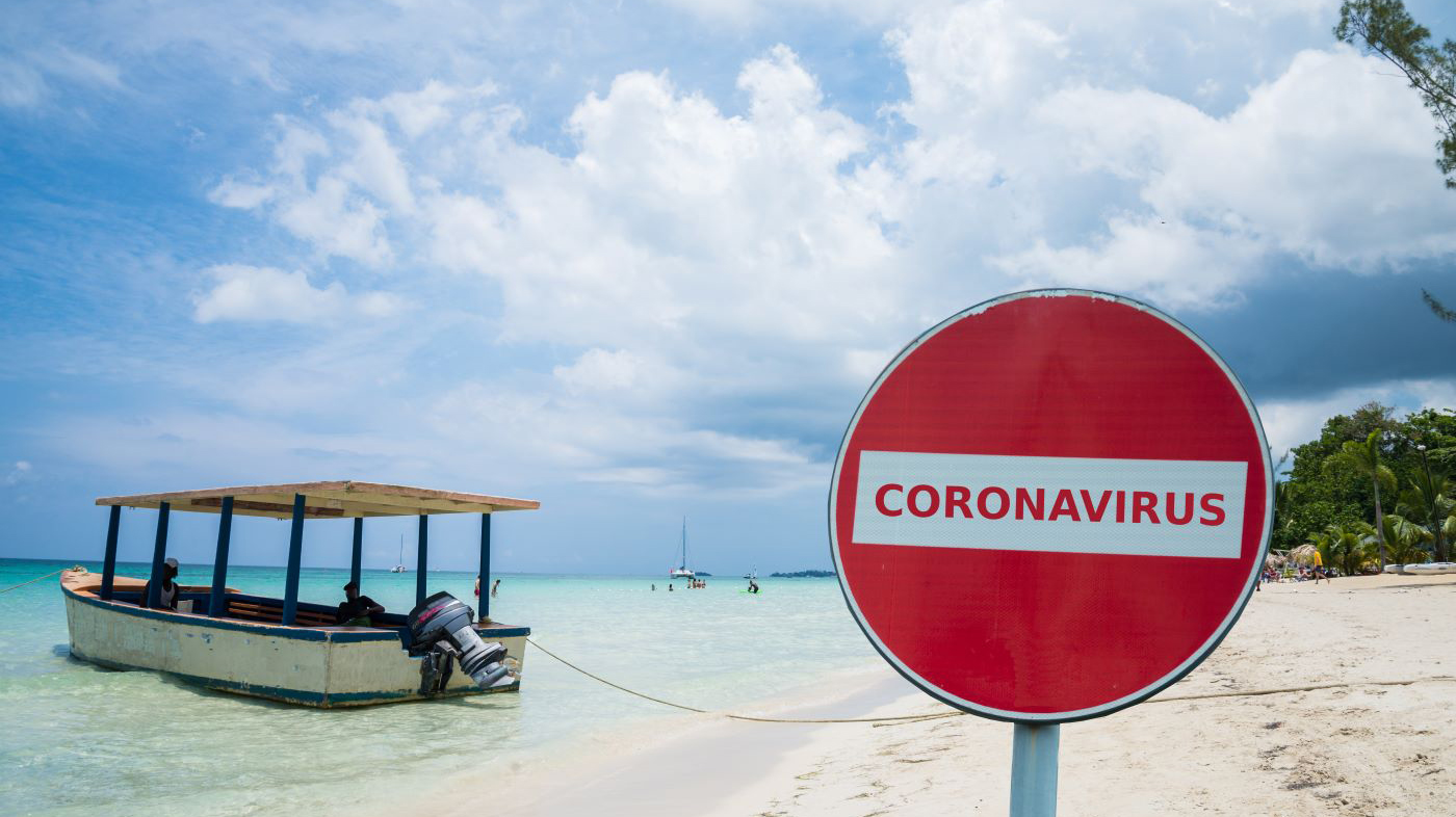 Coronavirus no-entry sign in front of a beach, Negril, Jamaica