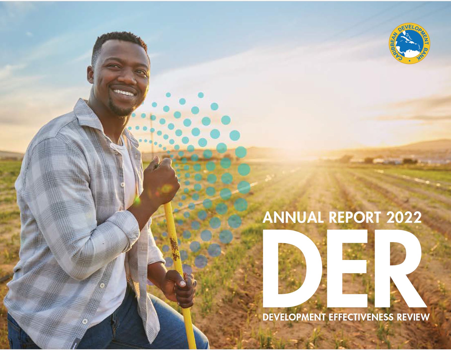 Black gentleman in a field smiling looking off into the distance with the sun setting behind him