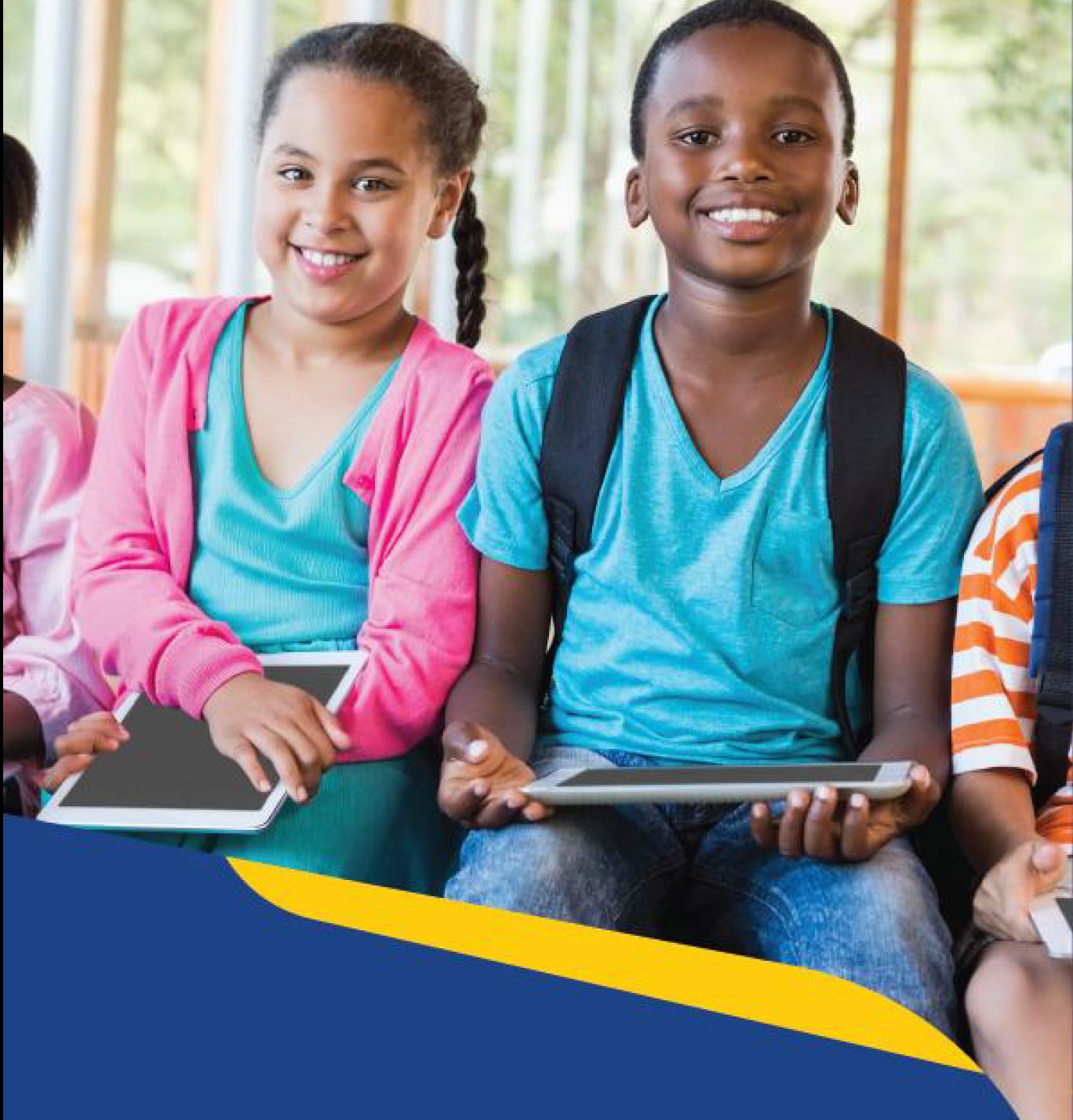 Smiling children in colourful outfits holding tablets and wearing backpacks for school