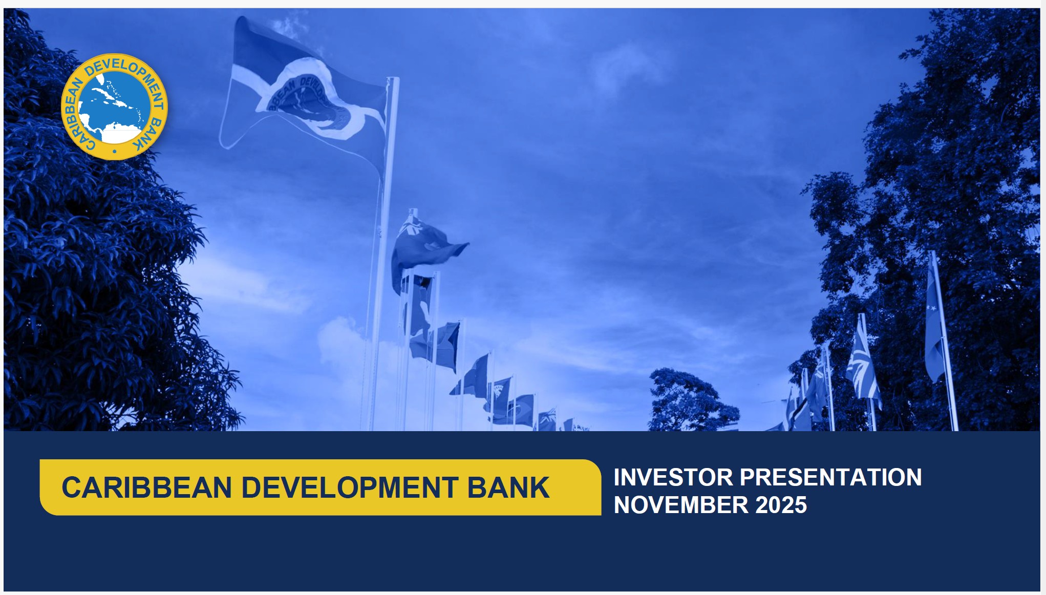 Row of international flags waving outdoors beside trees under a blue sky, with the Caribbean Development Bank logo and text reading ‘Investor Presentation November 2025.