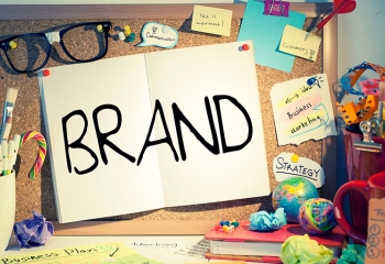 open book with the word 'Brand' written in all caps across two pages