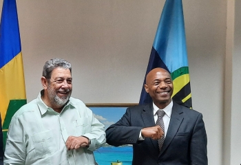 Photo #2  President of the Caribbean Development Bank (CDB) Dr. Gene Leon (left) is warmly greeted by Prime Minister of St. Vincent and the Grenadines, (SVG) Dr. Ralph Gonsalves
