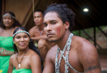 indigenous male looking into camera