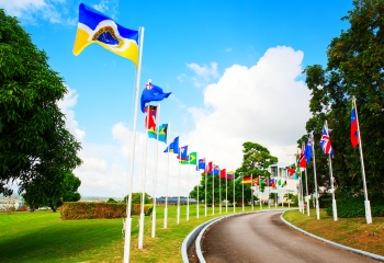 CDB driveway with member country flags blowing in the wind